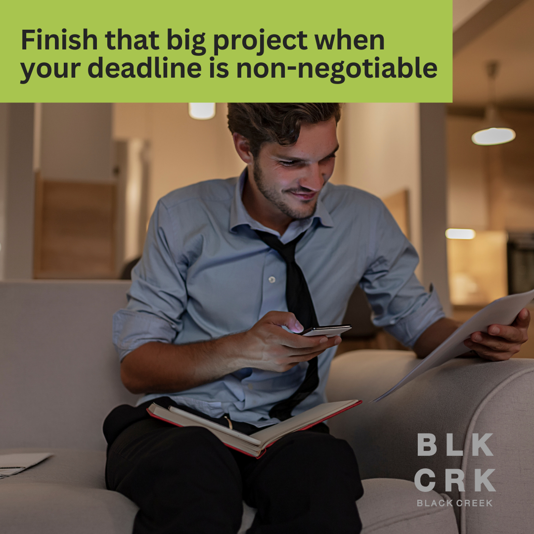 A man is working at night with a book and several papers scattered about him. He's on his phone and smiling. The caption says "finish that big project when your deadline is non-negotiable."The Black Creek CBD logo is at the bottom.