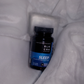 The Black Creek CBD Sleep Capsules lying in a white blanket